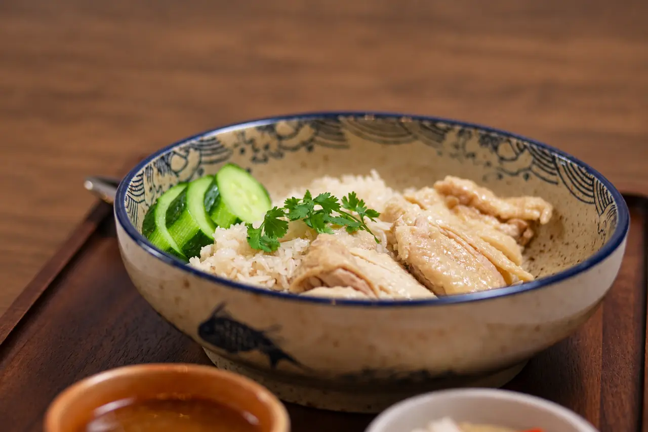 Kao Man Kai — Classic with braised chicken over rice and cucumber.